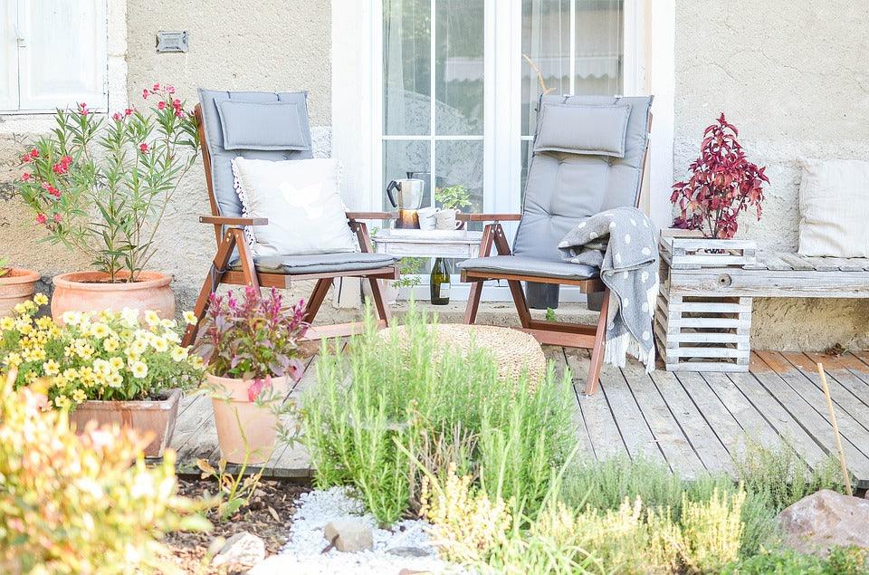 Rustic and classy outdoor furniture overlooking trees and greenery