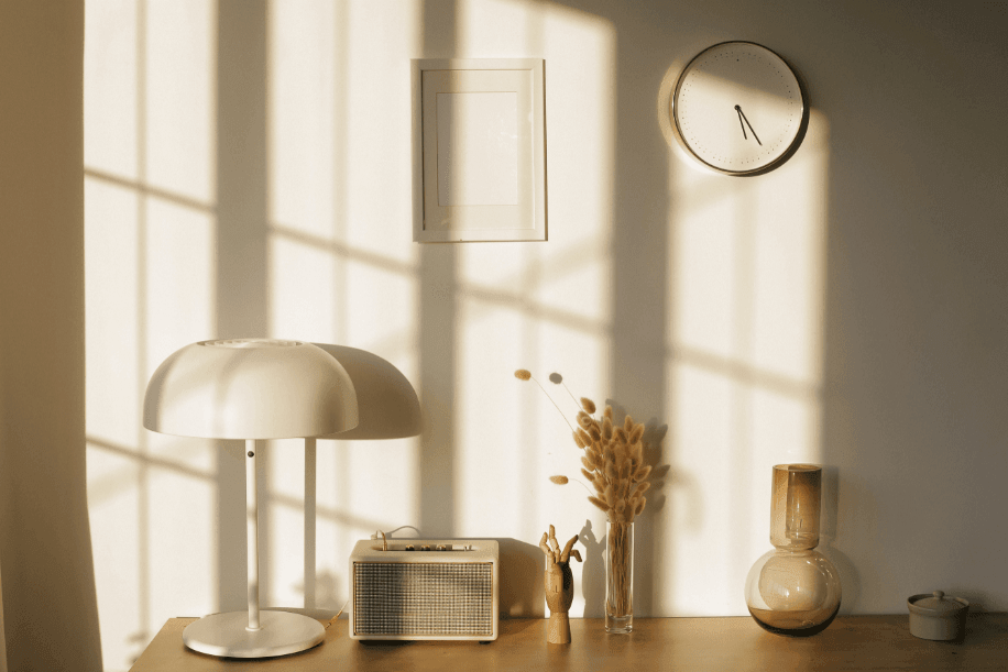 Sunlight reflecting off a wall in a room with neutral decor