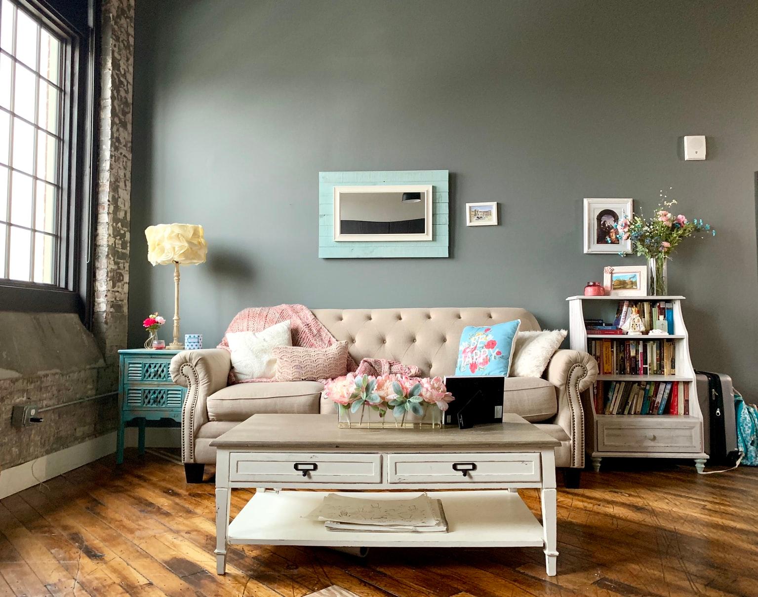 A comfortable living room with an upholstered couch and a quaint coffee table