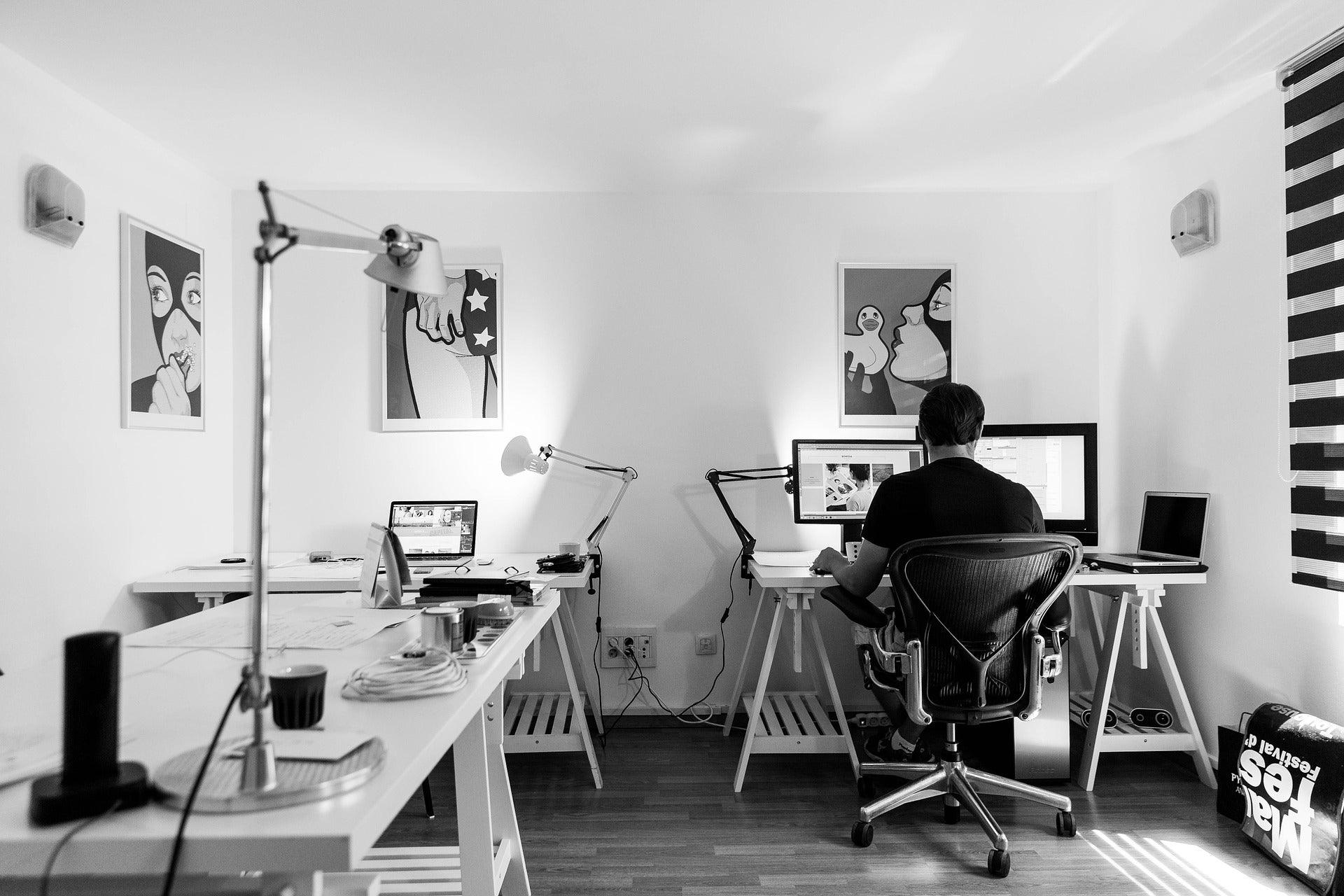 black and white image of man in home office - casaone